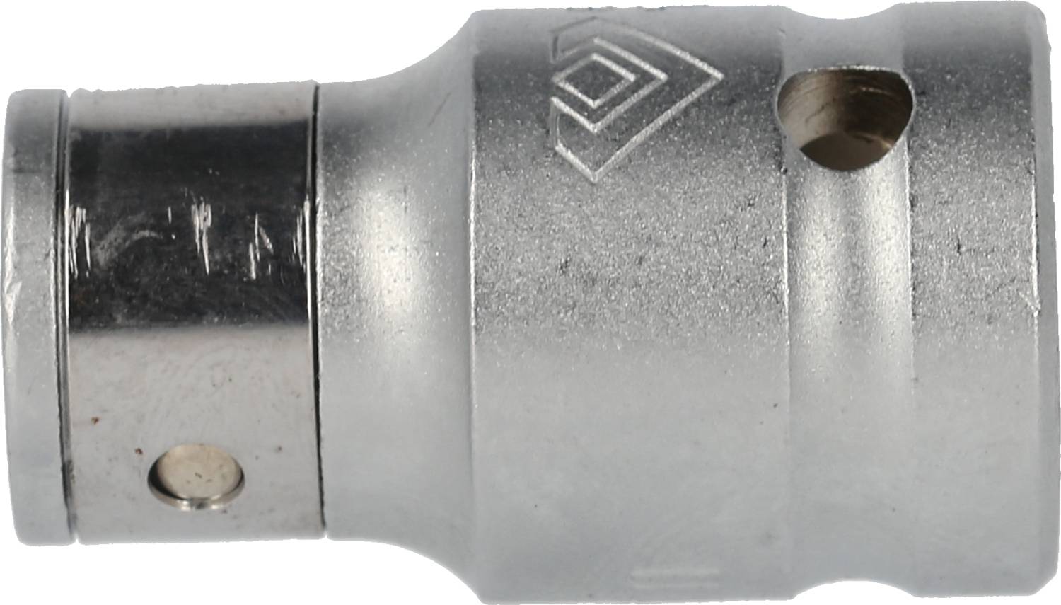 A silver metallic piece with a cylindrical shape and two lateral holes, potentially a component of a tool or machine part.