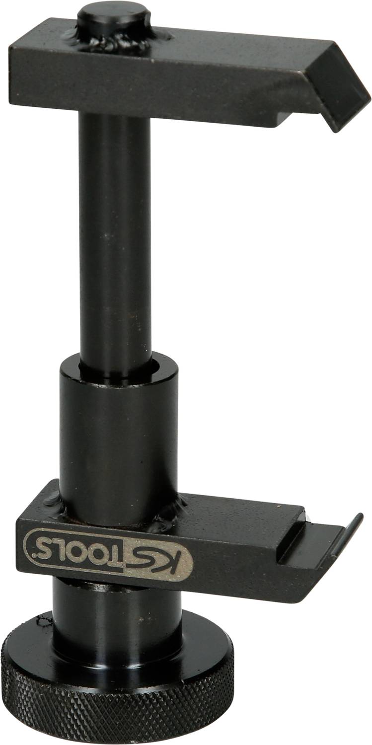 Black tool for securing camera lenses with a rotatable holding arm and adjustable foot.