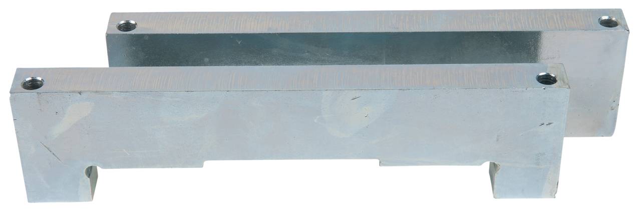 Two silver metal blocks with a rectangular shape and round drill holes at the corners, stacked in a slightly offset arrangement.