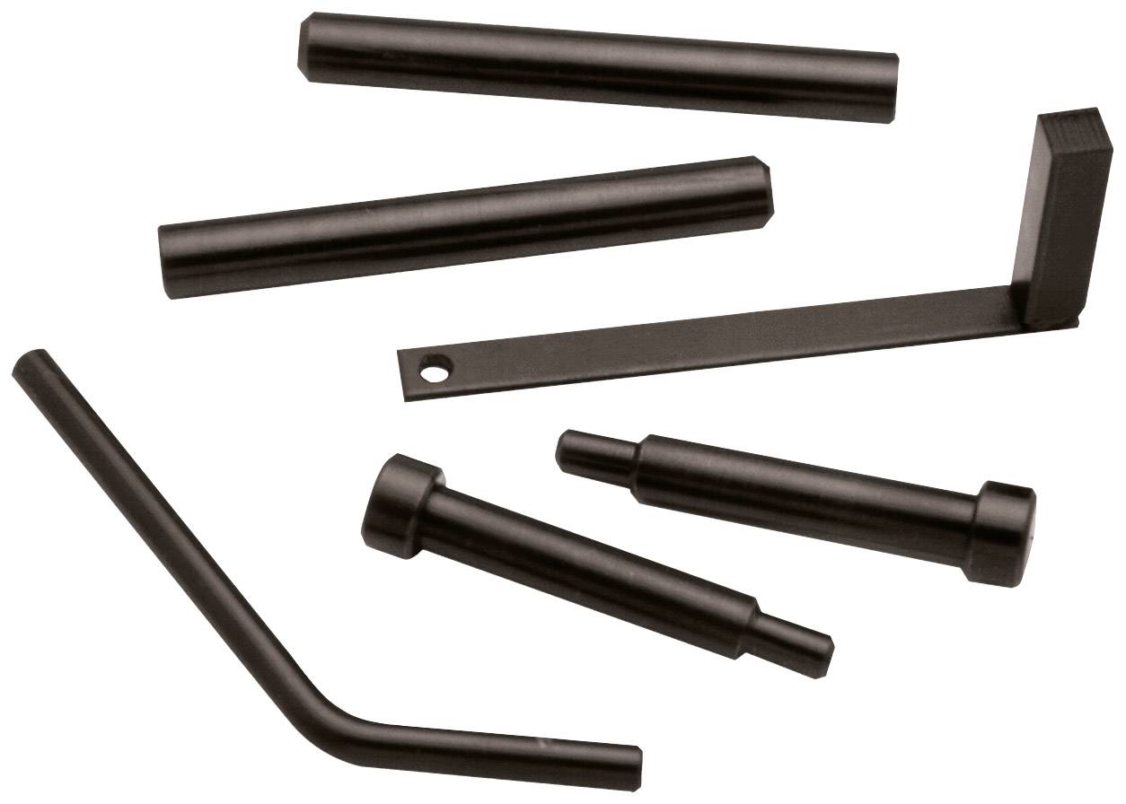 Black metal pins and levers in various shapes and sizes on a white background.