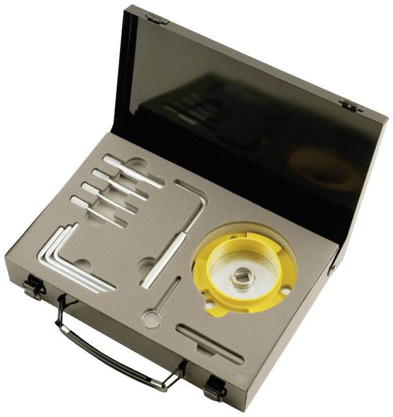 An open black toolbox displays precisely positioned spanners, Allen keys and a round yellow device.