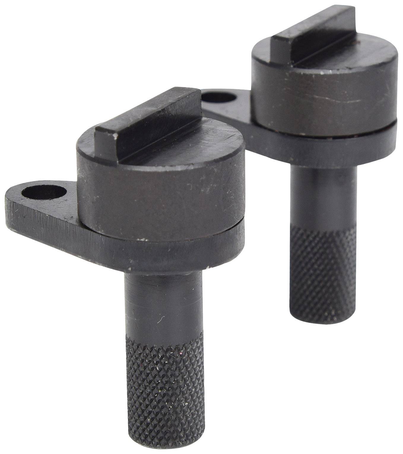 Two black metal holders with a round base and knurled handle, used for securing or holding workpieces in mechanical engineering applications.