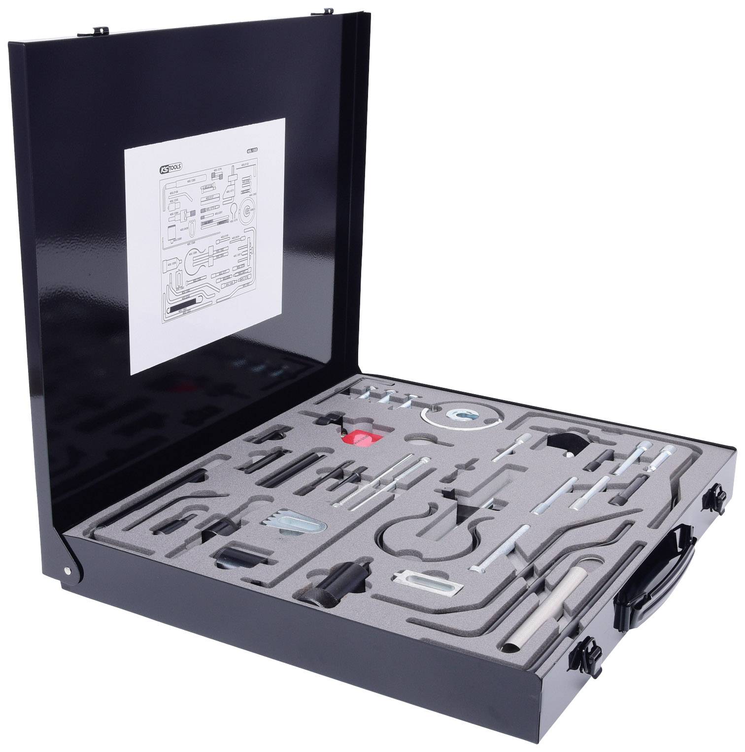 An open black suitcase with moulded foam that organises various tools. A diagram is attached to the inside of the lid.