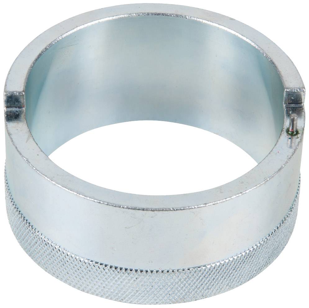 Metallic cylinder with a ridged edge and two small notches on the top surface, possibly a tool attachment.