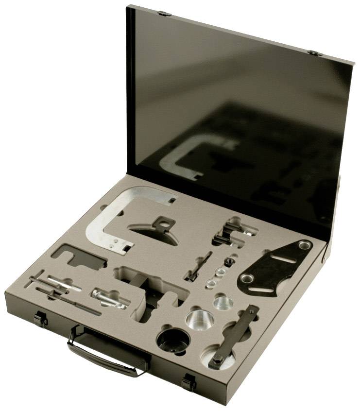 An open suitcase with specially shaped tools and metal components organised in a foam insert.