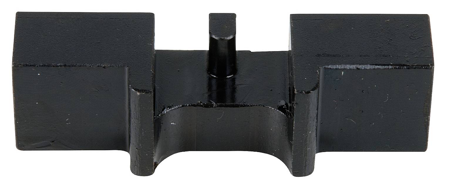 A black, rectangular metal part with a protruding pin in the centre; possibly a machine component or tool.