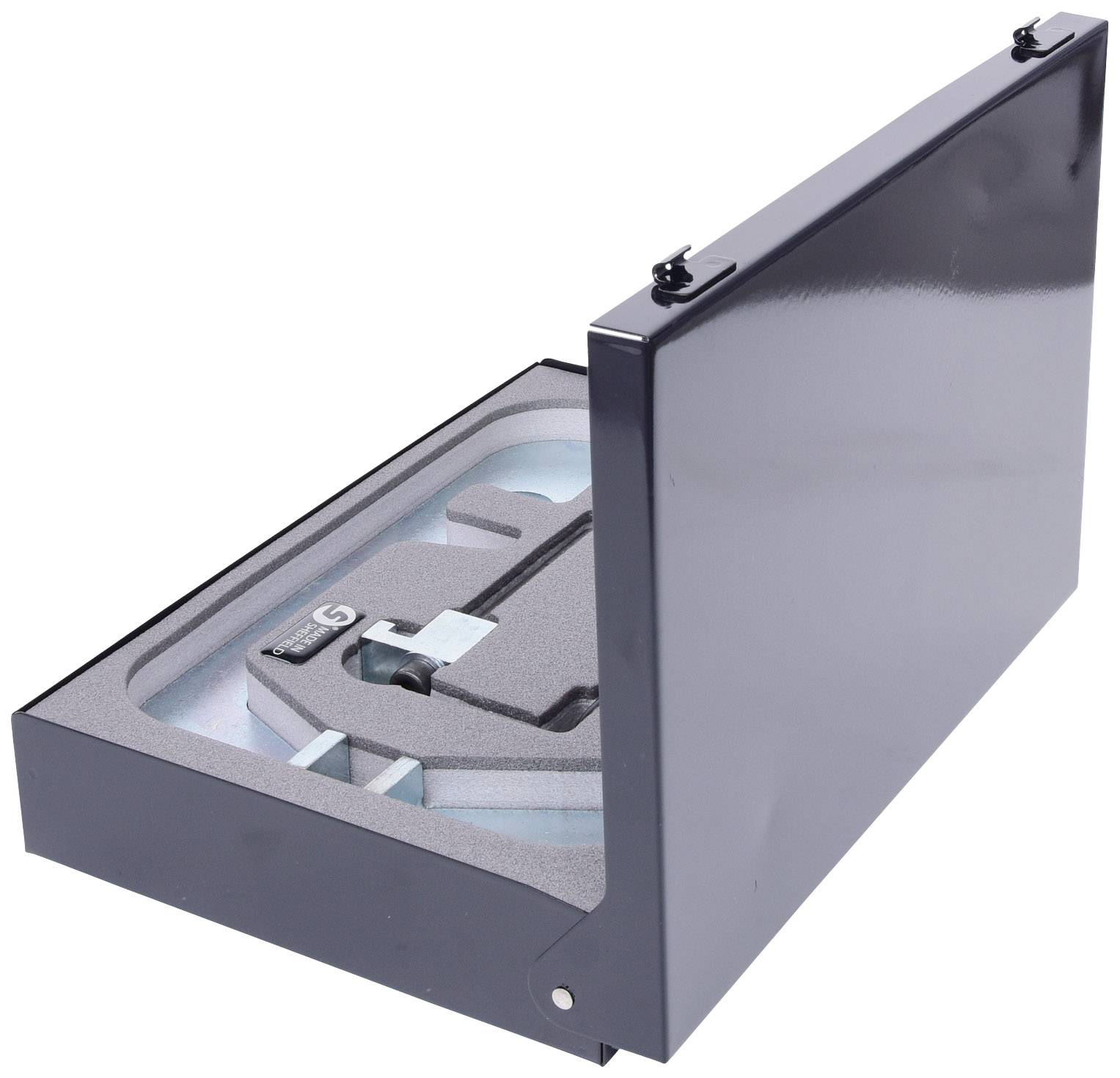 Black metal box partially open, revealing foam lining with a moulded space for a device.