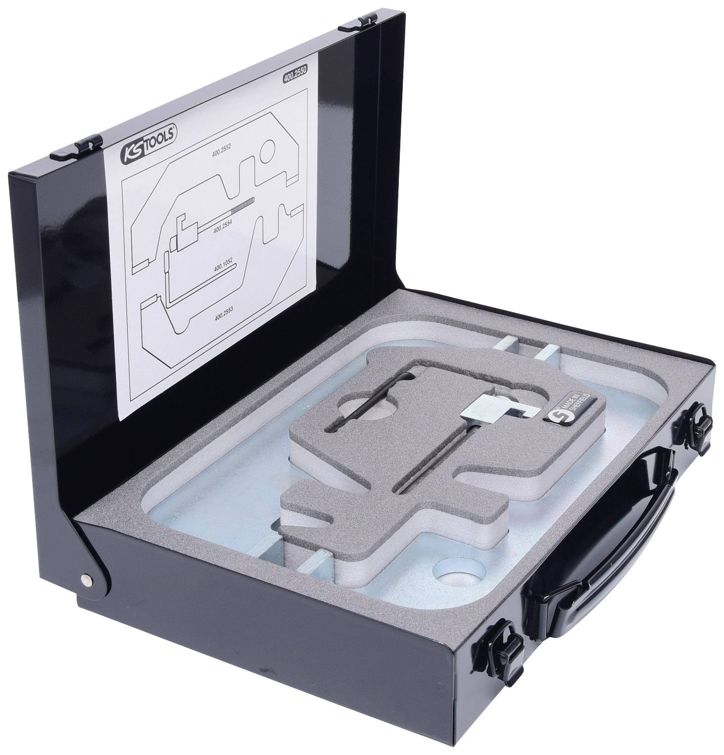 A black tool case with foam lining contains precisely arranged metal tools. A diagram is depicted on the lid.
