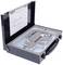 A black tool case with foam lining contains precisely arranged metal tools. A diagram is depicted on the lid.