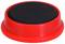 A red button with a black top, possibly used for a game or an activity.