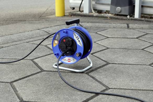 'Cable drum on a pavement'