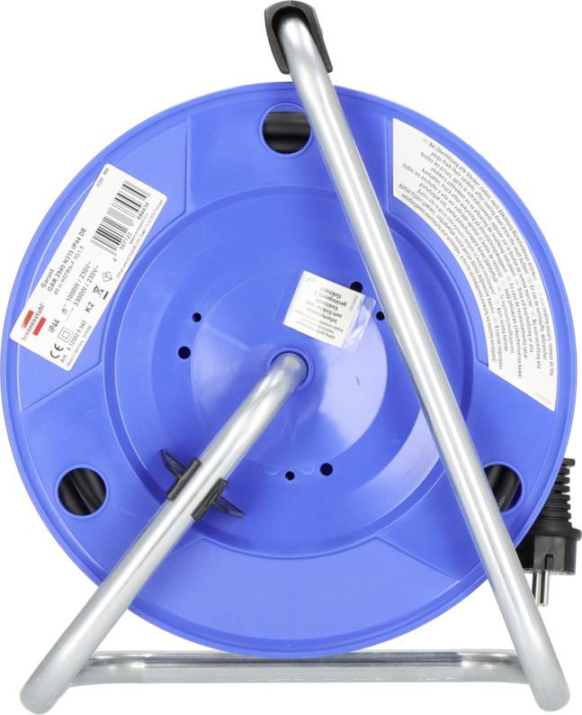 Blue cable reel on a silver stand, black socket at the edge, labels with product information and safety instructions.
