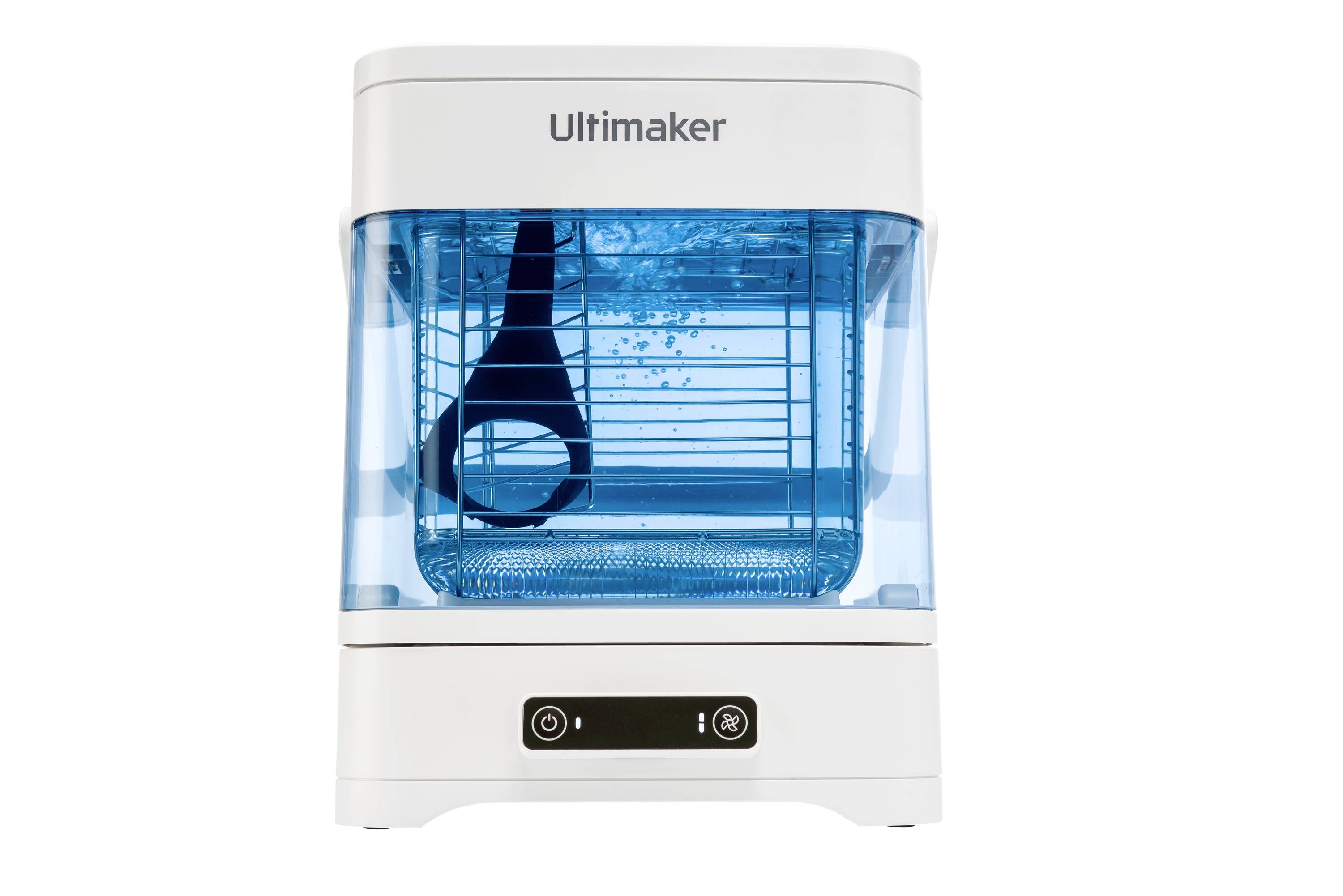 A white Ultimaker 3D printer with a transparent blue enclosure, filled with water. A black spatula is suspended in the water.