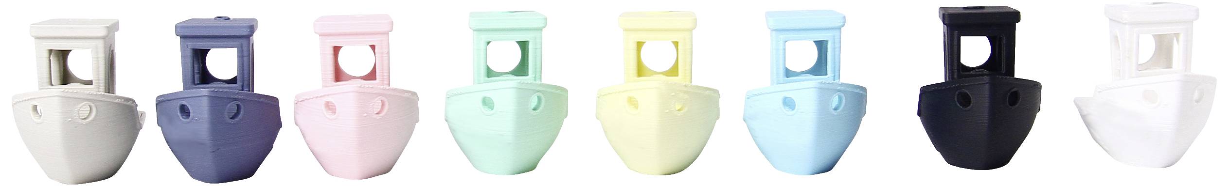 A row of coloured plastic clips, each with a round hole in the centre, in blue, pink, green, yellow, black and white.