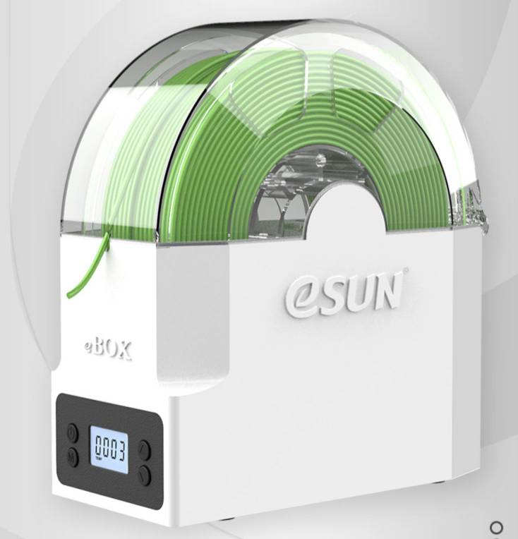 A white eSUN eBOX filament dryer with green filament and a digital display showing '0003'.