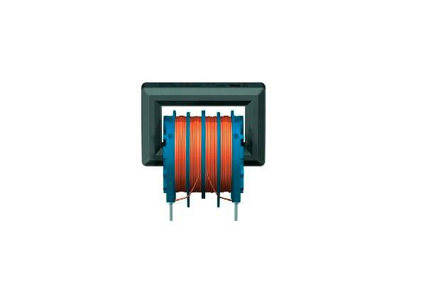 A transformer with copper-coloured coils in a rectangular casing. Key component for voltage conversion in electrical devices.