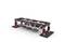 A LEGO Technic model of a bridge frame in black and red. It displays beams with bracing, standing on sturdy feet.