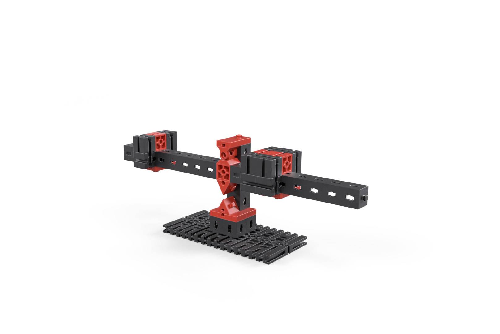 A black metal strip with red connecting elements mounted on a grey base. The design appears industrial and geometric.