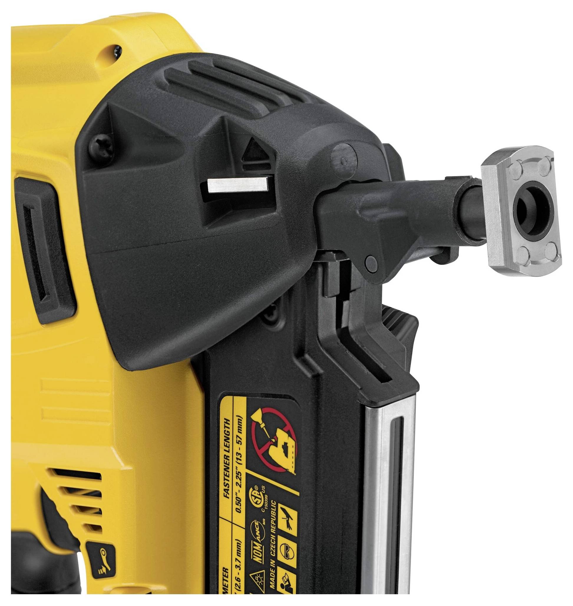 Yellow and black electric nail gun, close-up. The nozzle and safety warnings are visible on the side.