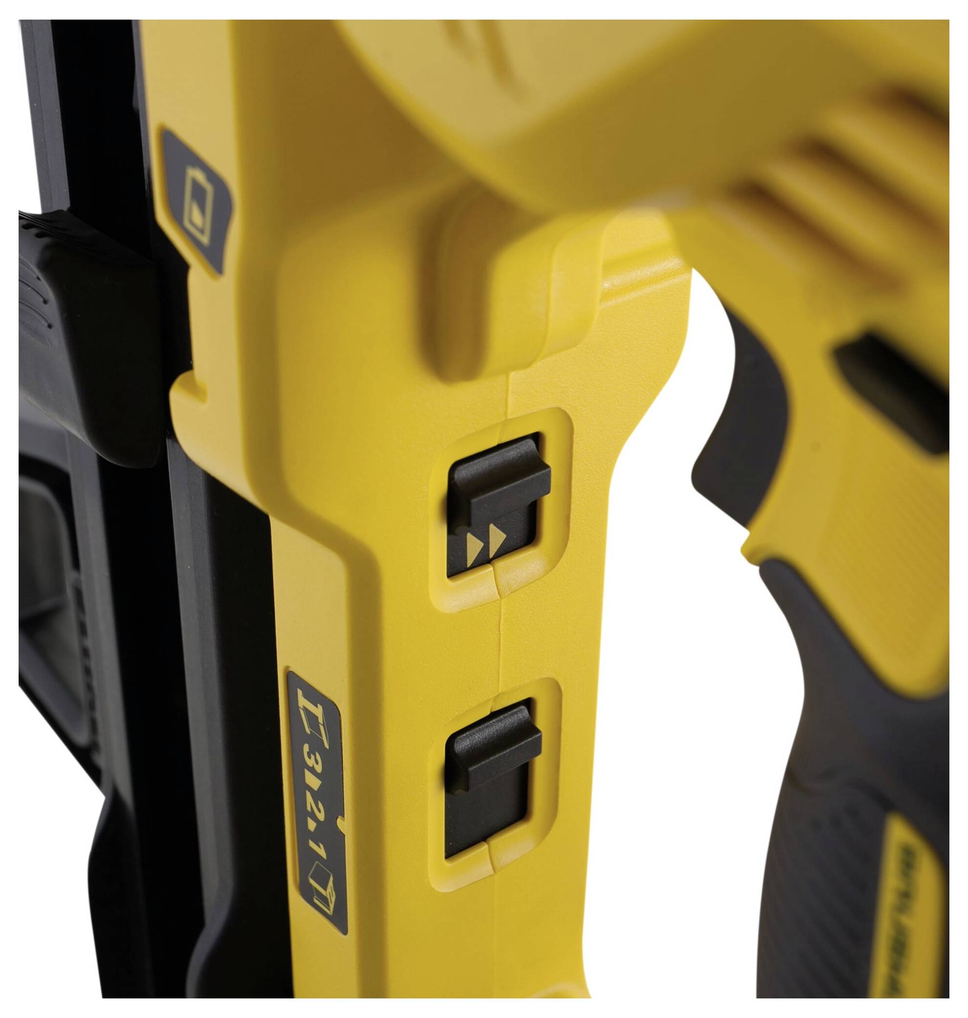 Close-up of a yellow power tool with two black switches in the central area. The tool is black and yellow and includes ergonomic details.