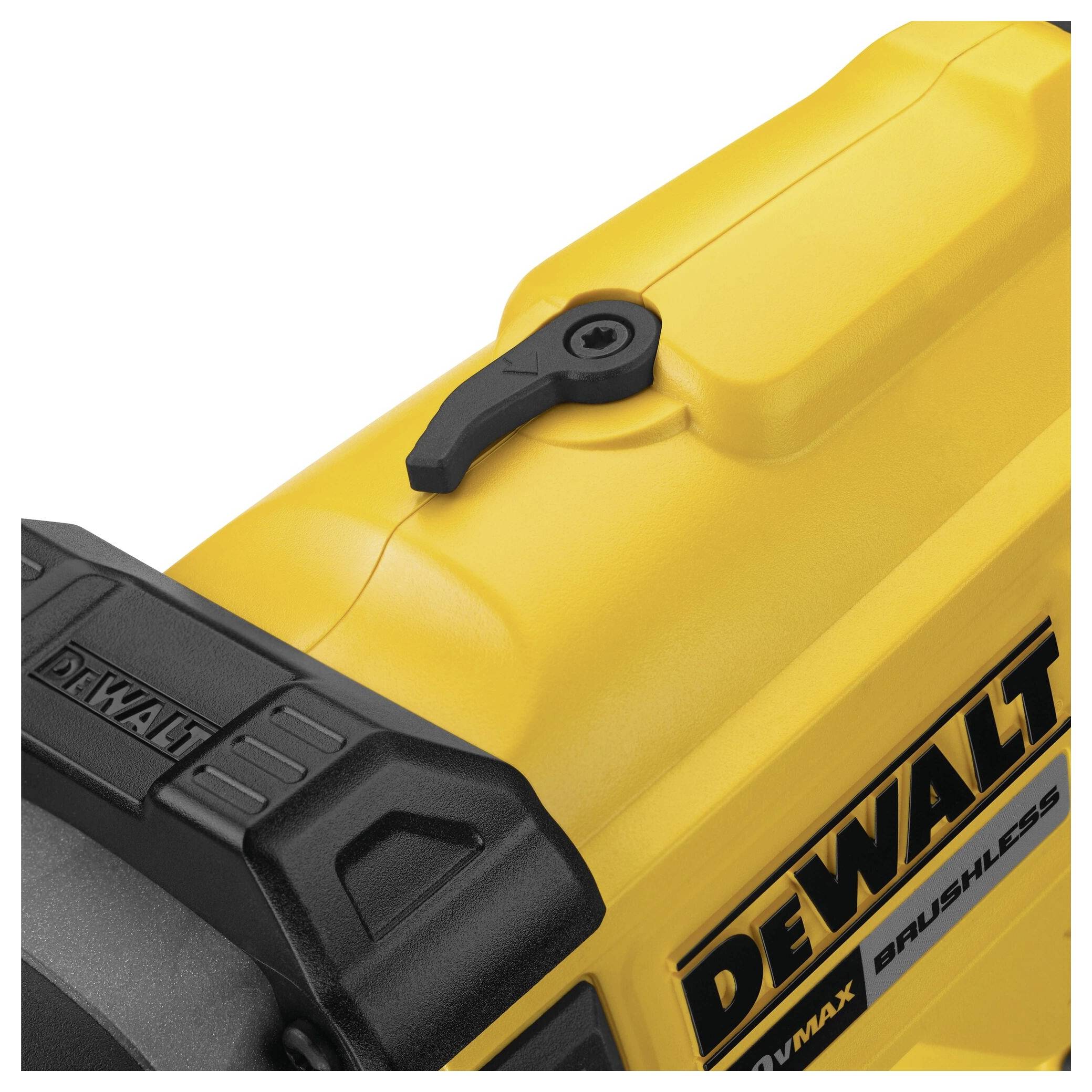 Yellow and black electrical power tool with 'DEWALT' printed on it. Focus on part of the housing and switch at the top.