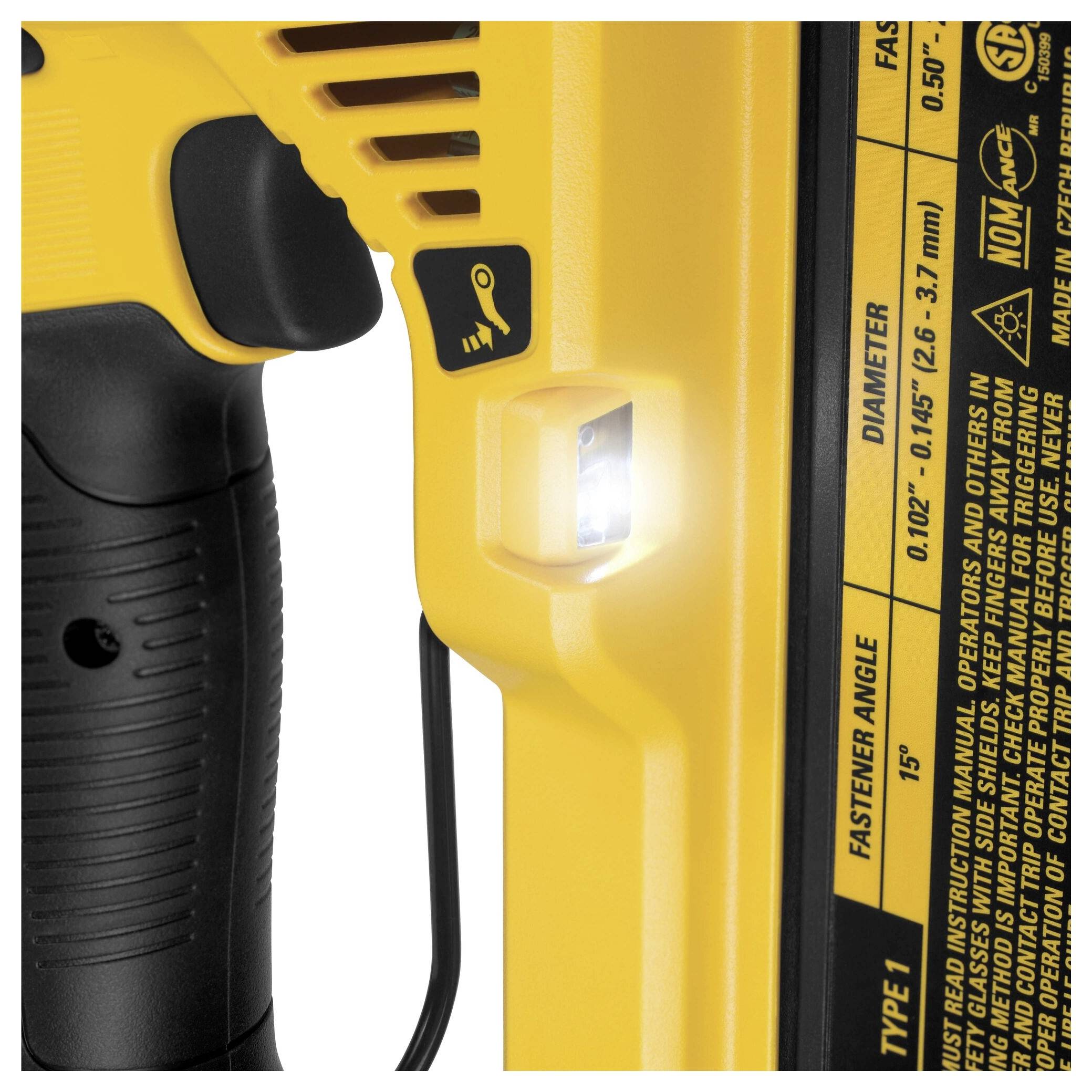 A section of a yellow electric tool with a light and printed specifications. Main function: shooting nails or screws.