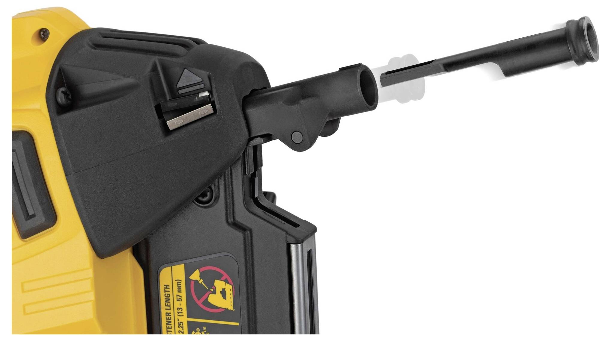 Close-up of a yellow nail gun with a black casing and warning labels. A long nail is being pushed out of the muzzle.