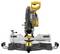 'Yellow mitre saw on workbench, showing front cutting area and safety guard. Ideal for woodworking and precise cuts.'