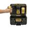 A hand is inserting a DeWalt battery into a charger located in an open DeWalt ToughSystem 2.0 case.