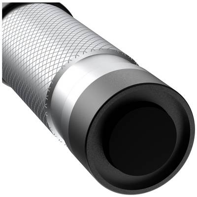 Close-up of a cable with a black, round connector and silver mesh detail.
