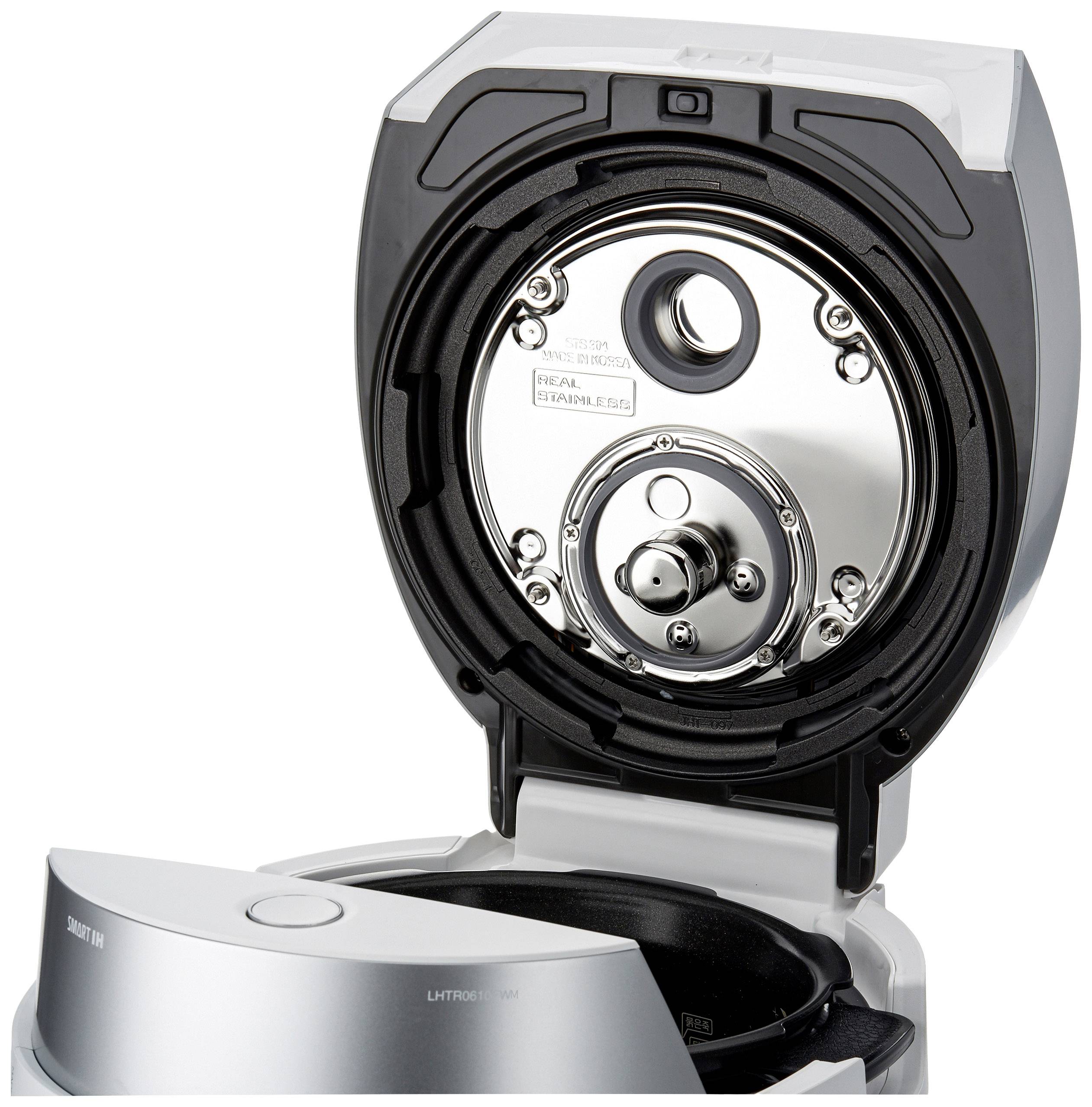 An open electric razor with a visible blade mechanism.