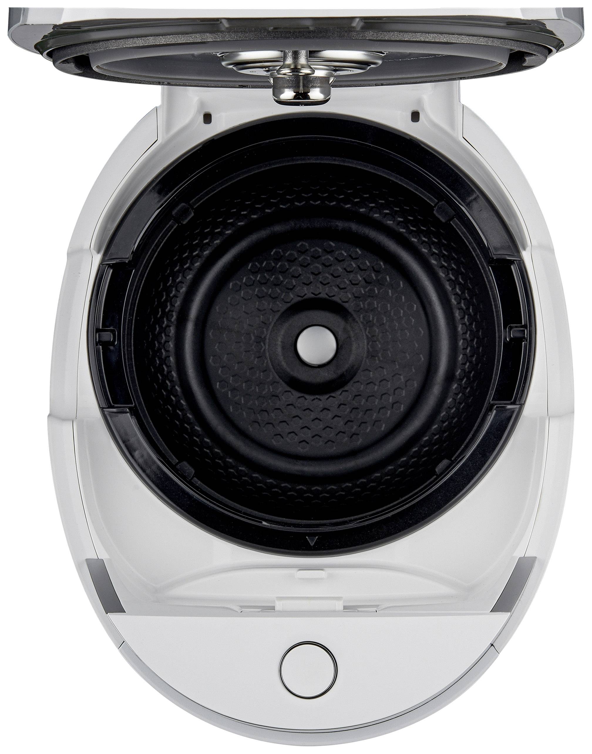 An air fryer container with an open lid, showing the interior and a circular cooking plate in the centre.