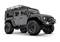 A grey off-road vehicle with large tyres and a roof rack, side view, suitable for off-road adventures.