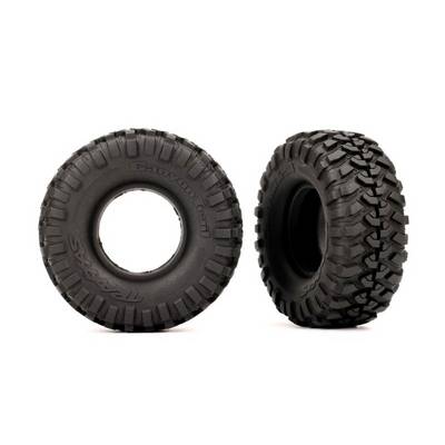 Two robust, treaded tyres with distinctive off-road tread patterns, one viewed from the front and one from the side, on a white background.