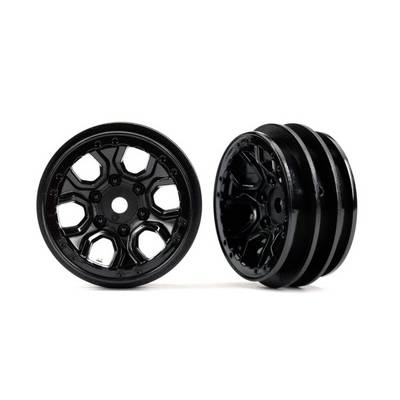 Two black plastic wheels, one standing and the other lying down, with hexagonal spokes and a ribbed surface.