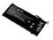 Black laptop battery with writing and symbols. Cable with plug protruding. Battery instructions and recycling symbols visible.