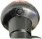 Close-up of a black, round lamp with a red upper section and a central button.
