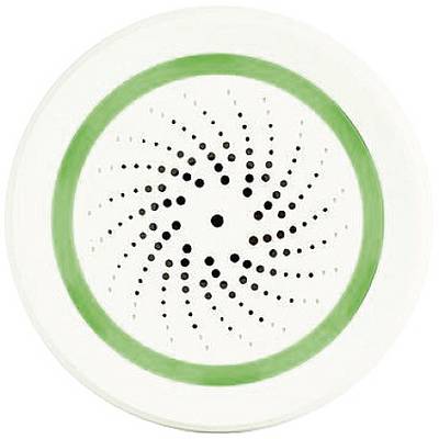 White circular object with a green circle and a spiral dotted pattern in the centre.