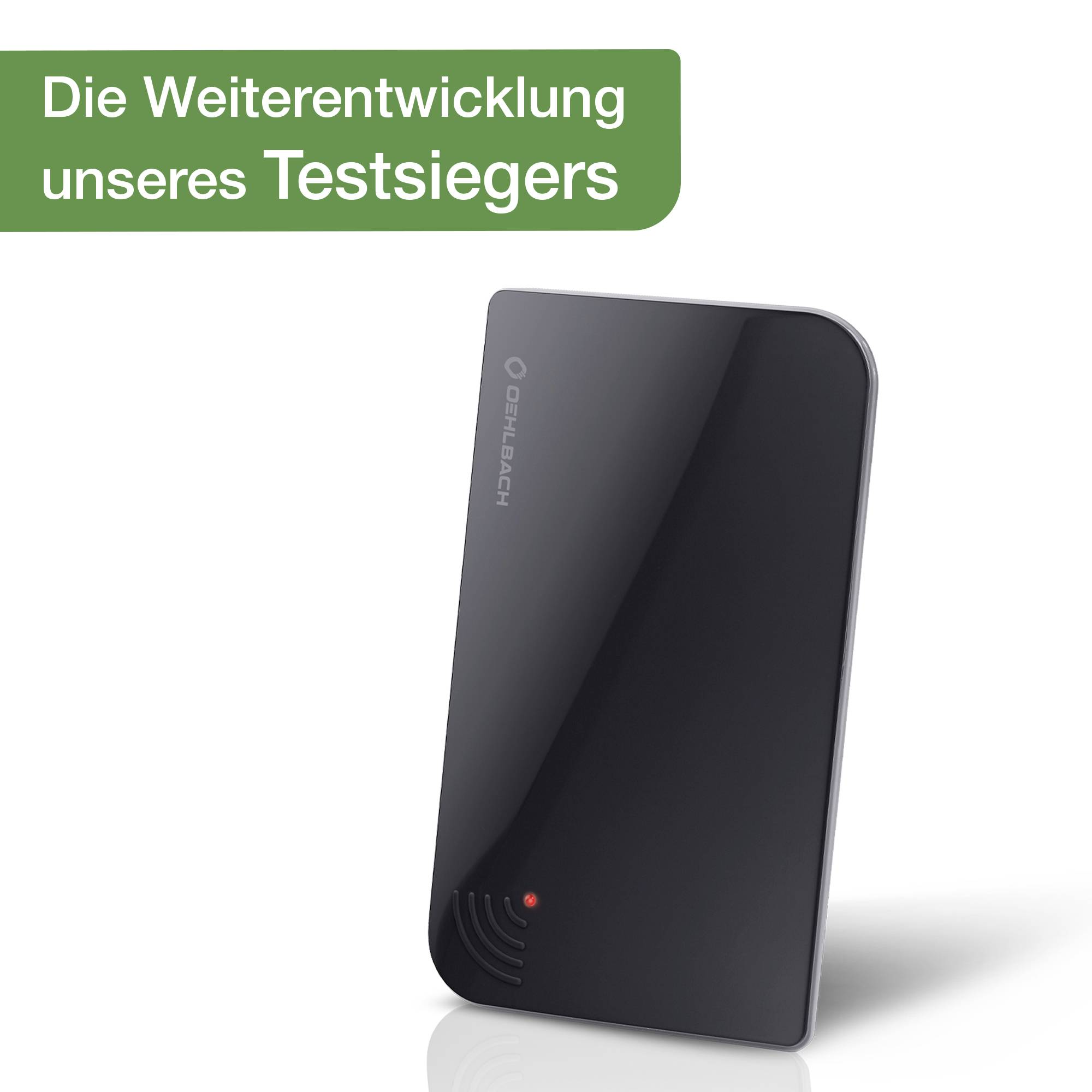 A black, glossy device with a red light at the front. At the top left, 'The further development of our test winner' is written on a green background.