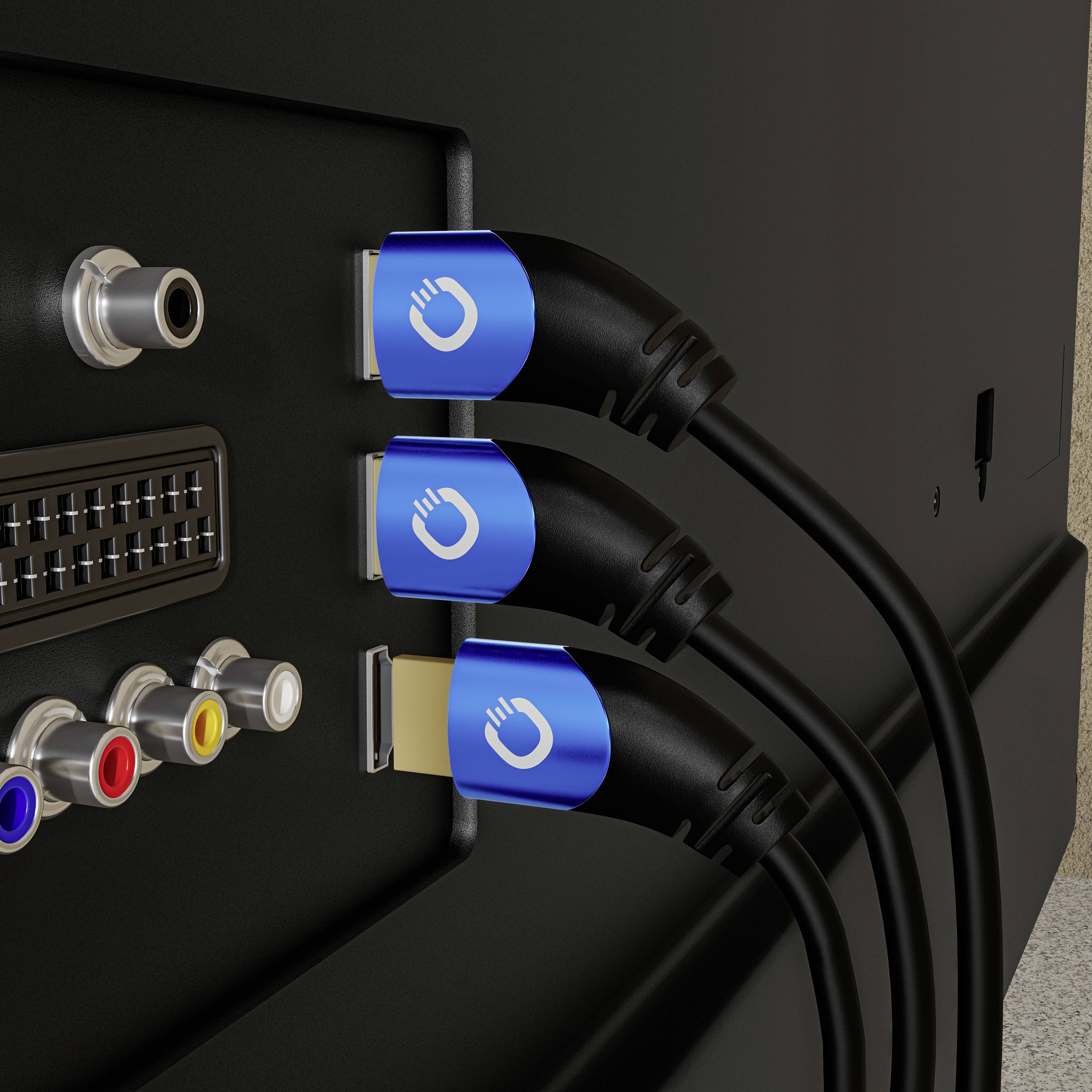 Three HDMI cables are plugged into the back of an electronic device, next to colourful A/V ports and an antenna socket.