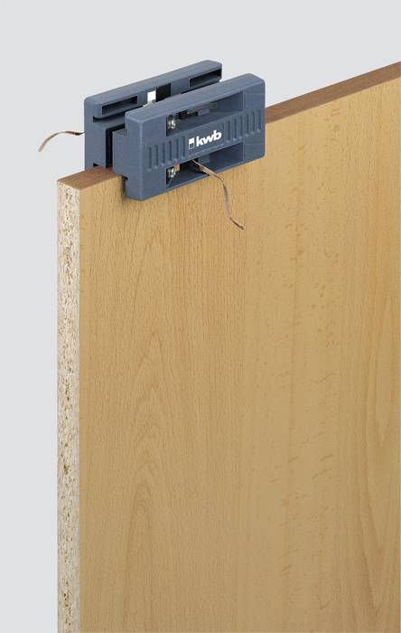 An edge bander is applied to a wooden board to seal the edges and enhance the appearance of the board.