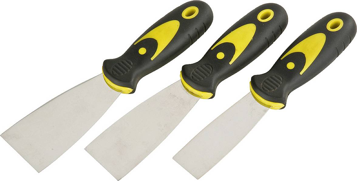 Three spatulas with yellow and black handles, lying side by side. They vary in the width of the metal blades.
