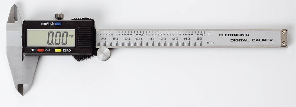 Electronic digital calliper with digital display showing 0.00 mm. The device has a scale for inches and millimetres.
