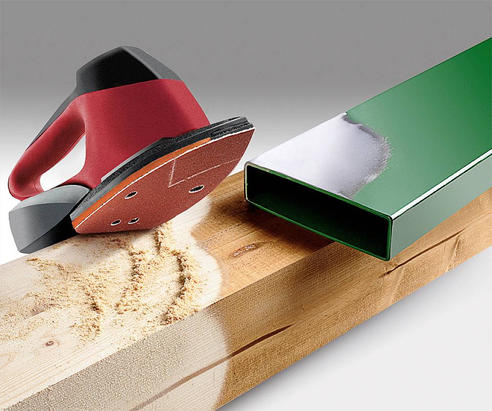 Wooden board, partially sanded with a sanding device; alongside a green-painted metal profile. Surface treatment illustrated.