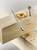 A wood drill bit and a drilled wooden board with wood shavings. A flat drill bit lies beside it.