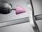 'Close-up of a rotary tool with a pink grinding head working on a metal edge.'