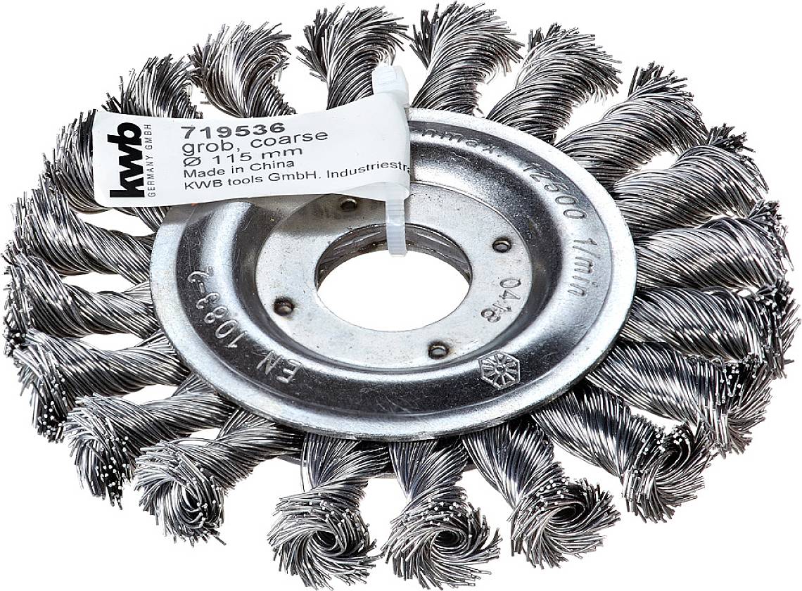 Wire brush wheel with twisted steel wires, product label shows details such as size (115 mm) and manufacturer (KWB tools).
