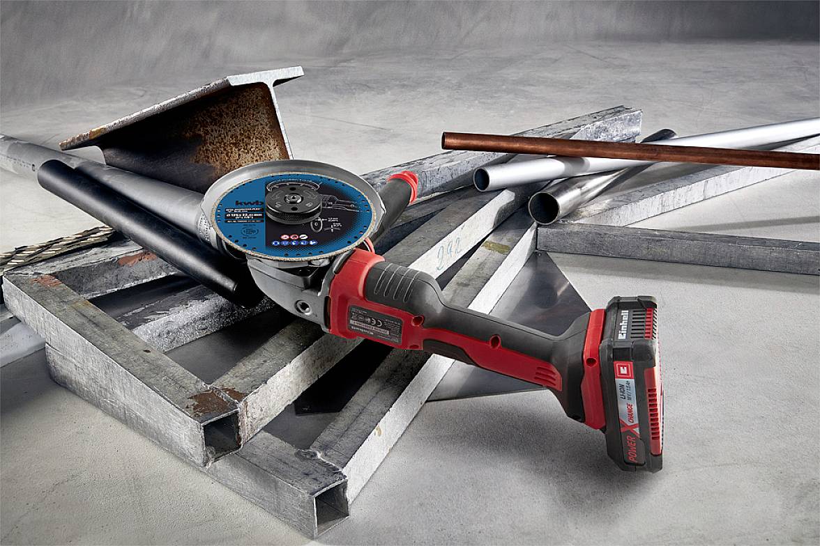 Angle grinders on steel beams and metal pipes. Ready for use, symbolising skilled craftsmanship and metalworking.