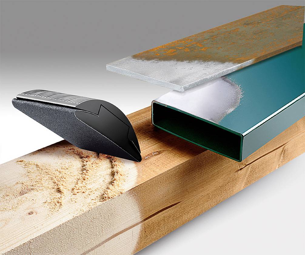 A wooden board and a metal profile are cleanly cut. A blade lies beside them. The blade cuts precisely through the material.