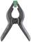 A black clip with serrated inner edges and a green plastic attachment at the tip.